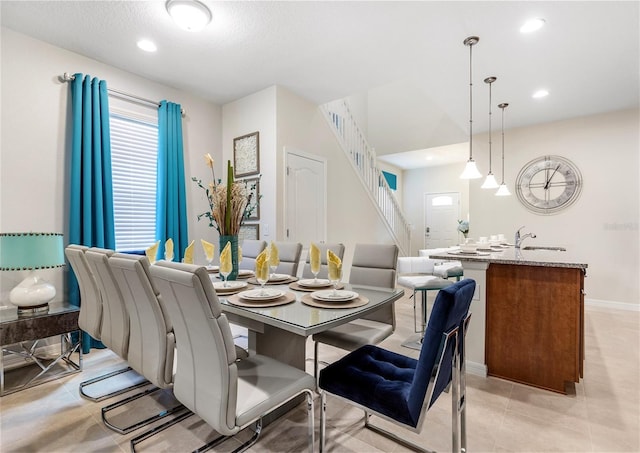 8874 Qin Loop, Kissimmee, FL 34747 - dining space featuring healthy amount of natural light, recessed lighting, stairway, and light tile patterned flooring