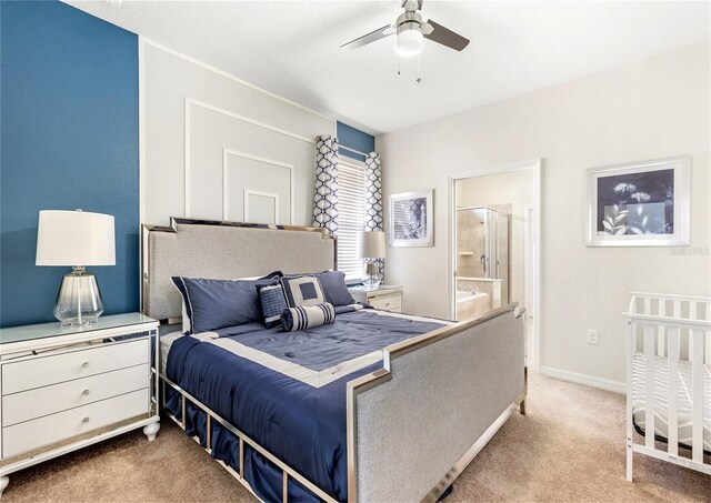 8874 Qin Loop, Kissimmee, FL 34747 - bedroom featuring carpet floors, ensuite bath, and a ceiling fan