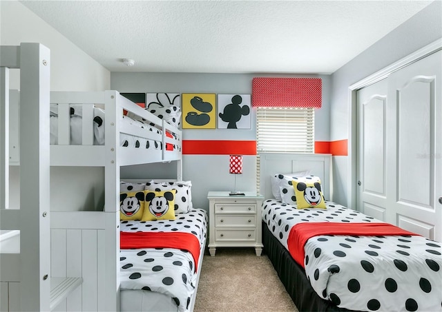 8874 Qin Loop, Kissimmee, FL 34747 - bedroom featuring carpet flooring and a textured ceiling