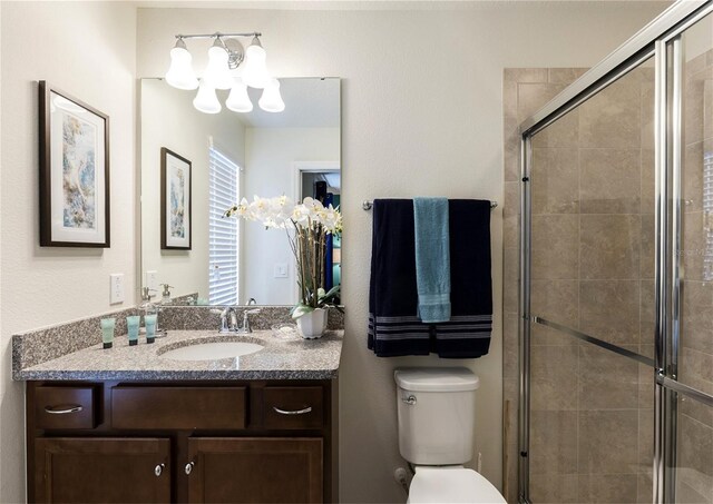 8874 Qin Loop, Kissimmee, FL 34747 - bathroom featuring a chandelier, vanity, and a shower stall