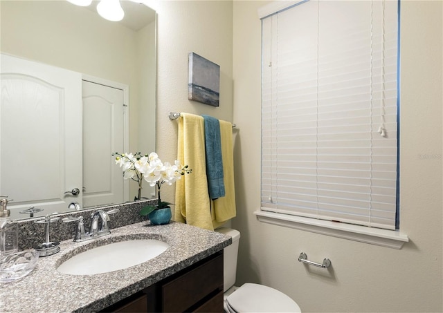 8874 Qin Loop, Kissimmee, FL 34747 - bathroom with vanity and toilet