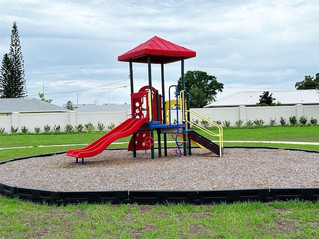 726 Ginger Dr, Haines City, FL 33844 - community play area featuring a lawn