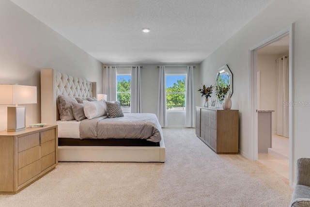 913 Halifax Dr, Kissimmee, FL 34758 - bedroom with carpet floors and a textured ceiling