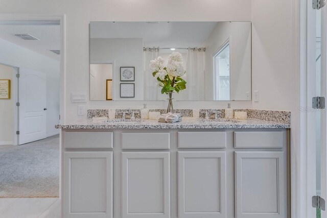 913 Halifax Dr, Kissimmee, FL 34758 - full bath featuring double vanity