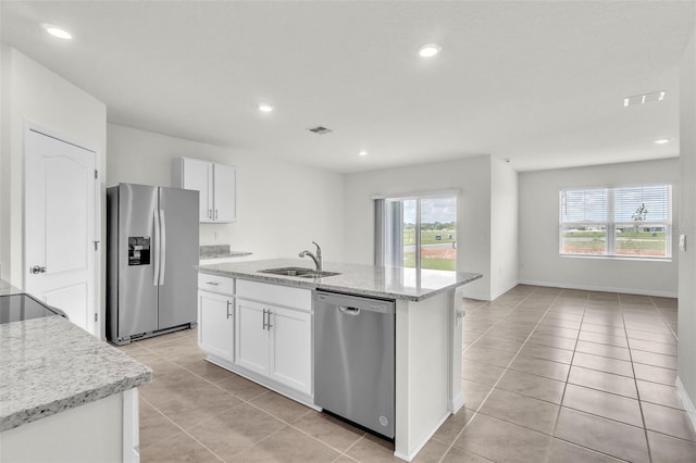 1850 Walnut Creek Dr, Kissimmee, FL 34744 - kitchen featuring stainless steel appliances, light tile patterned floors, white cabinetry, and recessed lighting