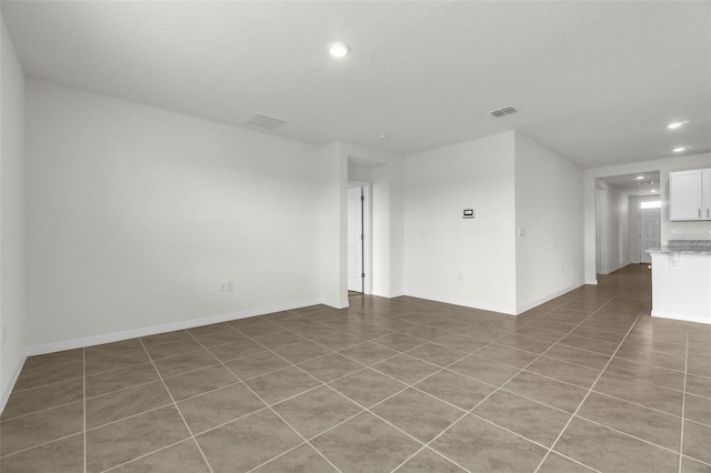 1850 Walnut Creek Dr, Kissimmee, FL 34744 - spare room featuring recessed lighting and light tile patterned flooring