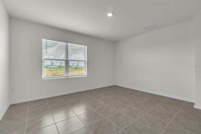 1850 Walnut Creek Dr, Kissimmee, FL 34744 - spare room with tile patterned floors