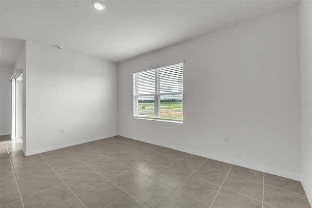 1850 Walnut Creek Dr, Kissimmee, FL 34744 - spare room featuring light tile patterned flooring and a smoke detector