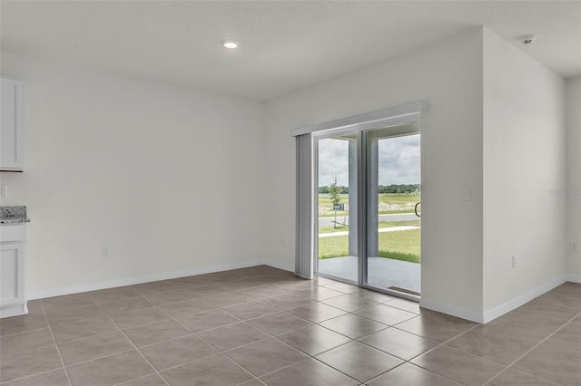 1850 Walnut Creek Dr, Kissimmee, FL 34744 - unfurnished room featuring light tile patterned floors and recessed lighting