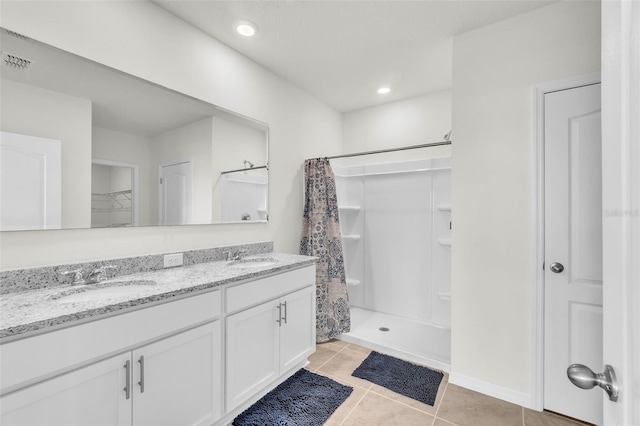 1850 Walnut Creek Dr, Kissimmee, FL 34744 - bathroom featuring double vanity, a closet, tile patterned flooring, curtained shower, and recessed lighting