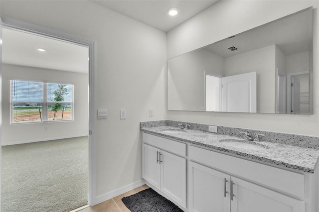 1850 Walnut Creek Dr, Kissimmee, FL 34744 - bathroom with double vanity, recessed lighting, and tile patterned flooring