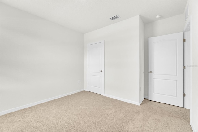 1850 Walnut Creek Dr, Kissimmee, FL 34744 - unfurnished bedroom featuring light colored carpet and baseboards
