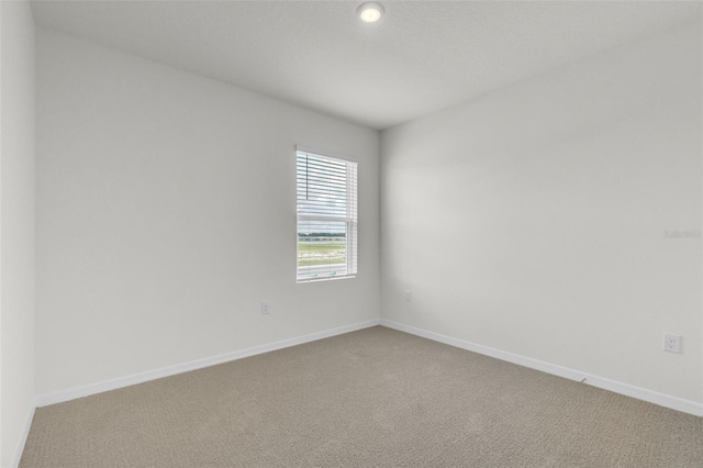 1850 Walnut Creek Dr, Kissimmee, FL 34744 - carpeted empty room with baseboards