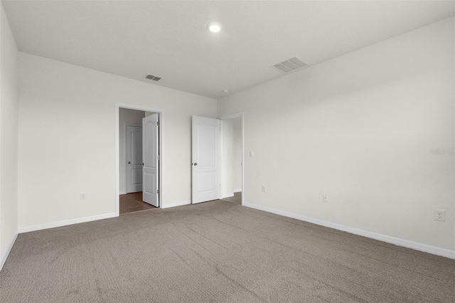 1850 Walnut Creek Dr, Kissimmee, FL 34744 - unfurnished bedroom with dark colored carpet, recessed lighting, and a spacious closet