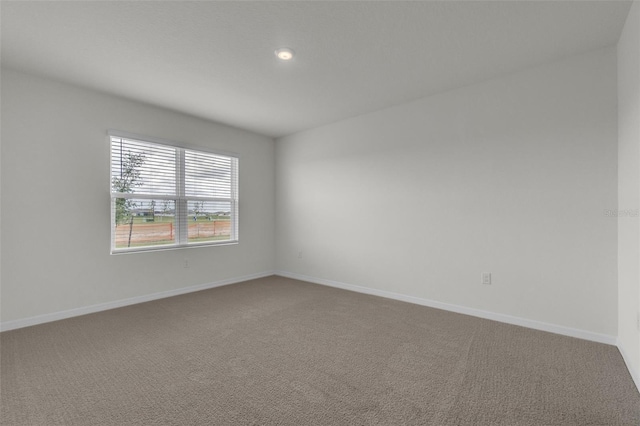 1850 Walnut Creek Dr, Kissimmee, FL 34744 - empty room with carpet floors and recessed lighting