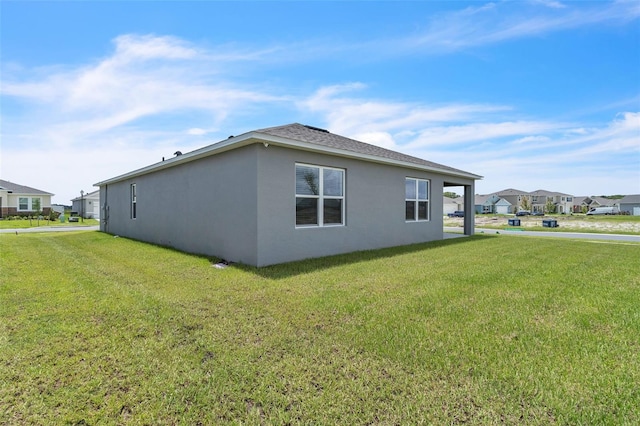 1850 Walnut Creek Dr, Kissimmee, FL 34744 - view of home's exterior featuring stucco siding and a lawn