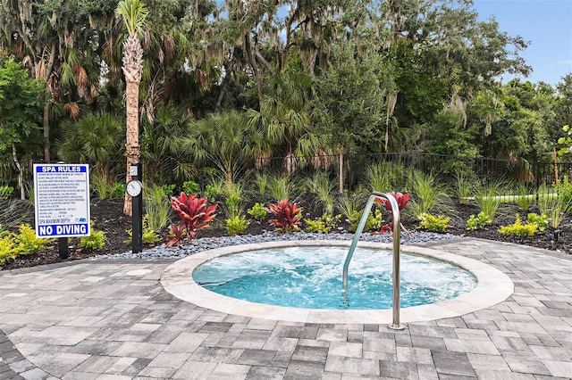 2661 Skyline Loop, Kissimmee, FL 34758 - view of swimming pool with a hot tub