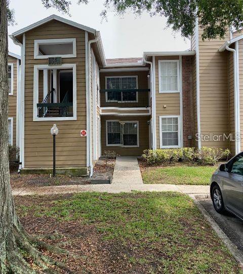 4367 Thornbriar Ln Unit 103, Orlando, FL 32822 - view of property with a chimney
