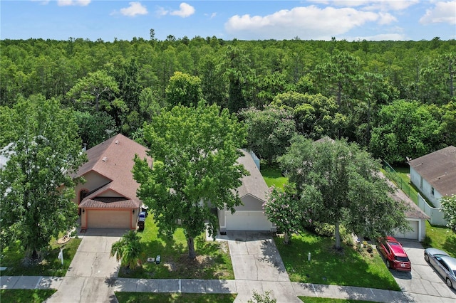 3388 Cypress Point Cir, Saint Cloud, FL 34772 - aerial view of property and surrounding area with a heavily wooded area