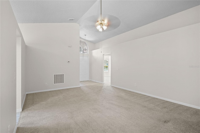 3388 Cypress Point Cir, Saint Cloud, FL 34772 - unfurnished room featuring ceiling fan, light carpet, and high vaulted ceiling