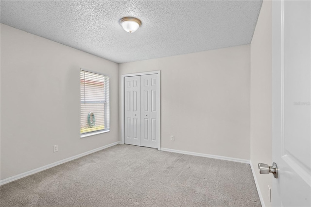 3388 Cypress Point Cir, Saint Cloud, FL 34772 - unfurnished bedroom featuring carpet, a textured ceiling, and a closet