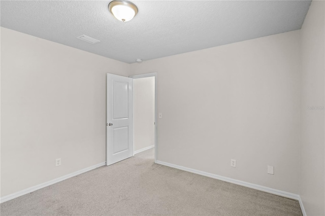 3388 Cypress Point Cir, Saint Cloud, FL 34772 - unfurnished room featuring light colored carpet and a textured ceiling