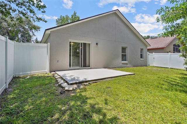 3388 Cypress Point Cir, Saint Cloud, FL 34772 - back of house featuring a patio area, stucco siding, and a fenced backyard