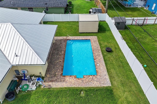 2912 SW Savona Blvd, Port St Lucie, FL 34953 - view of pool featuring a storage unit and a fenced backyard
