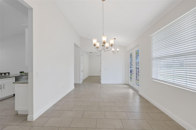 2912 SW Savona Blvd, Port St Lucie, FL 34953 - unfurnished dining area featuring a chandelier, vaulted ceiling, and light tile patterned floors