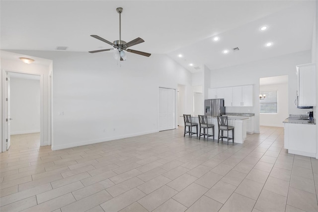 2912 SW Savona Blvd, Port St Lucie, FL 34953 - living area with ceiling fan, recessed lighting, high vaulted ceiling, and a chandelier