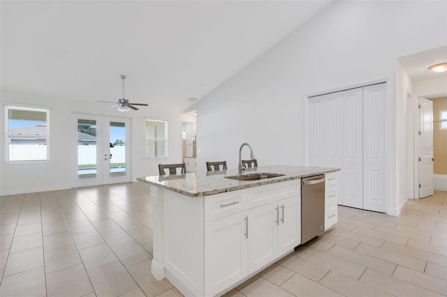 2912 SW Savona Blvd, Port St Lucie, FL 34953 - kitchen featuring dishwasher, light tile patterned flooring, open floor plan, ceiling fan, and a center island with sink