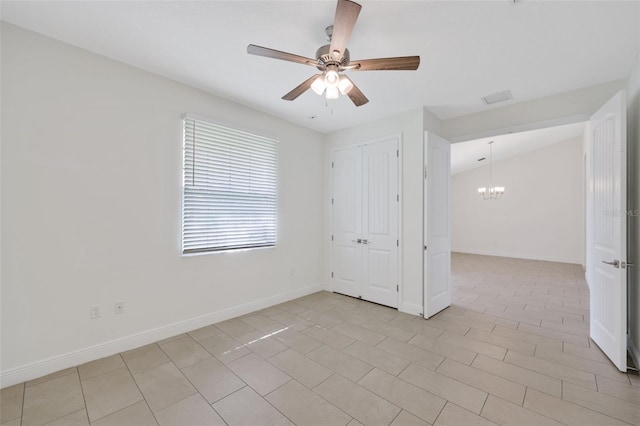 2912 SW Savona Blvd, Port St Lucie, FL 34953 - unfurnished bedroom with a chandelier, light tile patterned floors, a closet, and ceiling fan