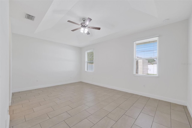 2912 SW Savona Blvd, Port St Lucie, FL 34953 - empty room featuring ceiling fan and a tray ceiling