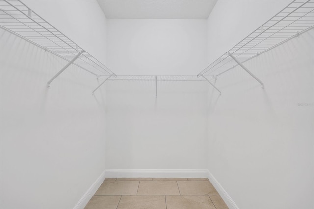 2912 SW Savona Blvd, Port St Lucie, FL 34953 - walk in closet featuring light tile patterned flooring