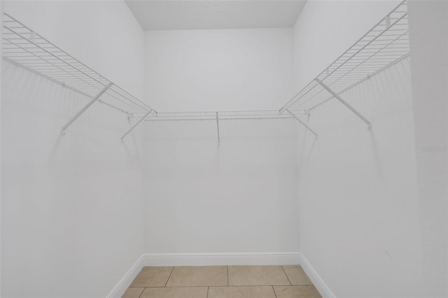 2912 SW Savona Blvd, Port St Lucie, FL 34953 - walk in closet with light tile patterned floors