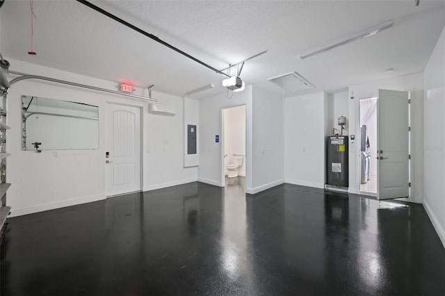2912 SW Savona Blvd, Port St Lucie, FL 34953 - garage with water heater, a garage door opener, and electric panel