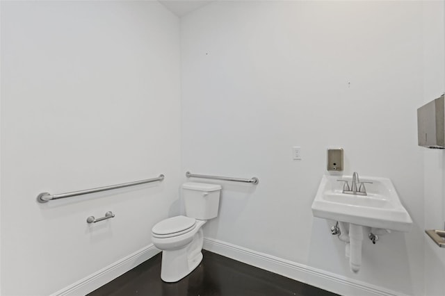 2912 SW Savona Blvd, Port St Lucie, FL 34953 - bathroom featuring toilet and baseboards