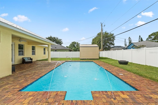 2912 SW Savona Blvd, Port St Lucie, FL 34953 - view of swimming pool with a fenced backyard, a patio area, a storage unit, and a ceiling fan
