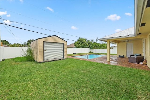 2912 SW Savona Blvd, Port St Lucie, FL 34953 - fenced backyard with a patio, a ceiling fan, a storage unit, and an outdoor hangout area