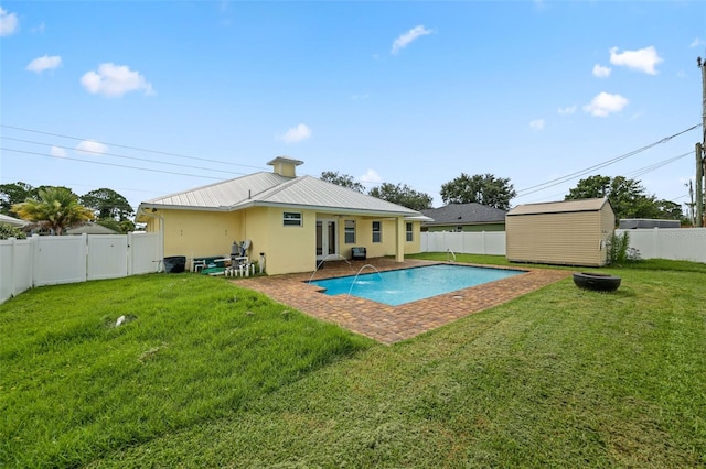 2912 SW Savona Blvd, Port St Lucie, FL 34953 - back of property with a fenced backyard, a shed, a metal roof, and stucco siding