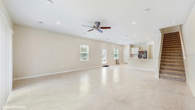 4501 Sparkling Shell Ave, Kissimmee, FL 34746 - unfurnished living room featuring stairs, ceiling fan, recessed lighting, and light tile patterned floors