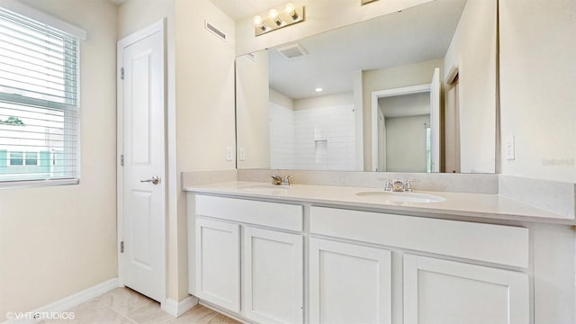 4501 Sparkling Shell Ave, Kissimmee, FL 34746 - full bathroom featuring double vanity and baseboards