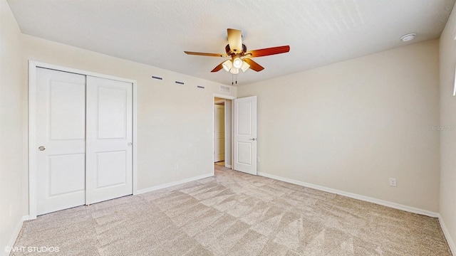 4501 Sparkling Shell Ave, Kissimmee, FL 34746 - unfurnished bedroom with carpet floors, a closet, and ceiling fan