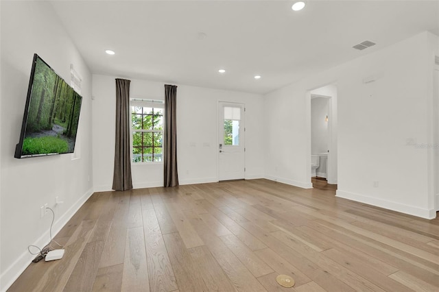 7412 Estuary Lake Loop, Celebration, FL 34747 - unfurnished living room featuring light wood-style floors and recessed lighting