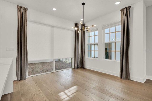 7412 Estuary Lake Loop, Celebration, FL 34747 - spare room featuring light wood-style floors, a chandelier, and recessed lighting