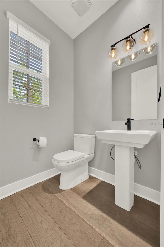 7412 Estuary Lake Loop, Celebration, FL 34747 - bathroom with toilet and wood finished floors