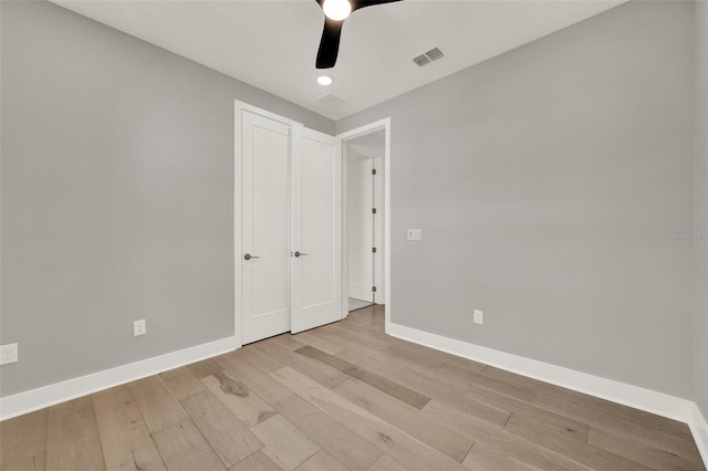 7412 Estuary Lake Loop, Celebration, FL 34747 - unfurnished bedroom featuring light wood-style flooring, ceiling fan, and recessed lighting