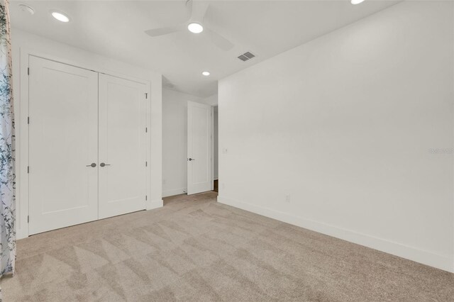 7412 Estuary Lake Loop, Celebration, FL 34747 - unfurnished bedroom with carpet, recessed lighting, a ceiling fan, and a closet