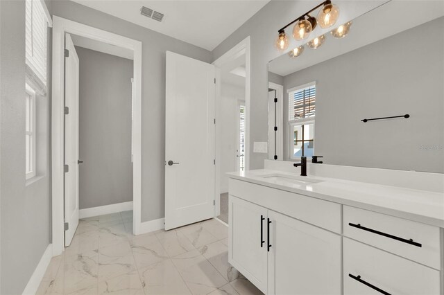 7412 Estuary Lake Loop, Celebration, FL 34747 - bathroom featuring marble finish flooring and vanity