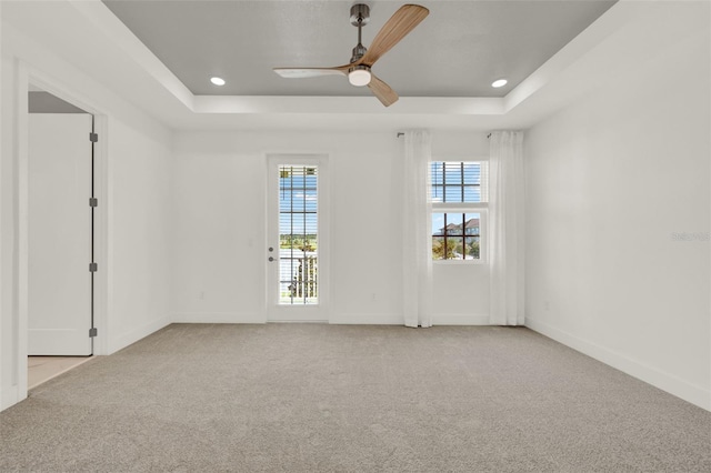 7412 Estuary Lake Loop, Celebration, FL 34747 - carpeted empty room featuring a tray ceiling, a ceiling fan, and recessed lighting